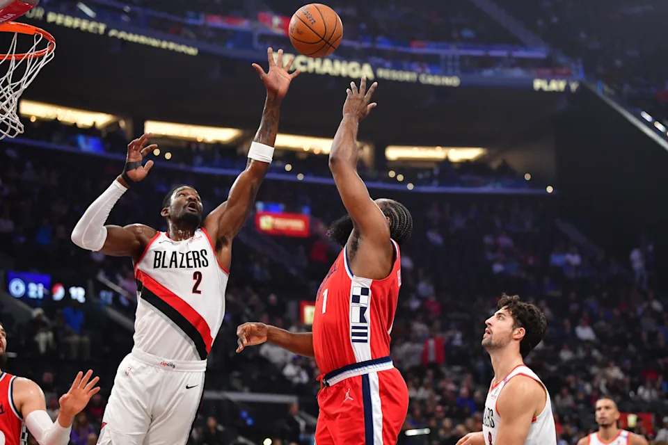 Dec 3, 2024; Inglewood, California, USA; Portland Trail Blazers center Deandre Ayton (2) blocks the shot of Los Angeles Clippers guard James Harden (1) during the first half at Intuit Dome. Mandatory Credit: Gary A. Vasquez-Imagn Images