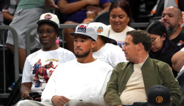 Phoenix Suns guard Devin Booker next to Suns and Mercury owner Mat Ishbia as Mercury played host to...