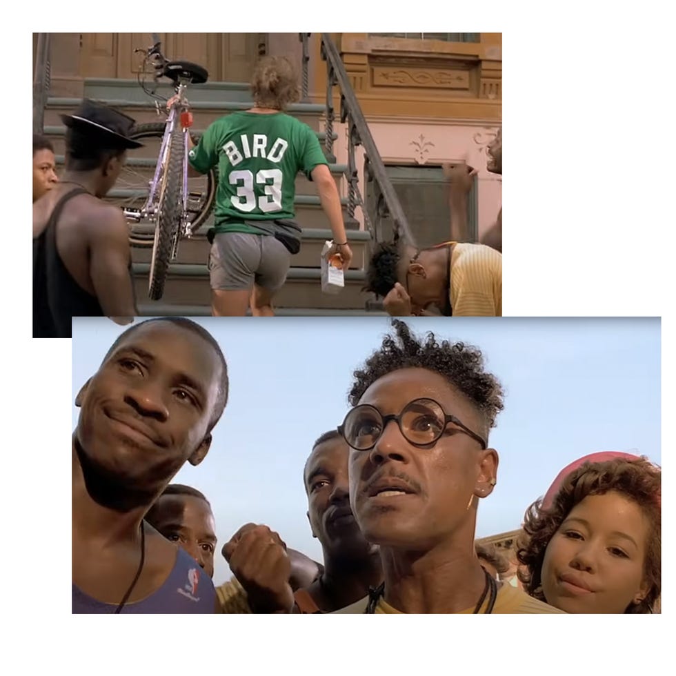 a young person with a bicycle interacting with a group in a neighborhood setting