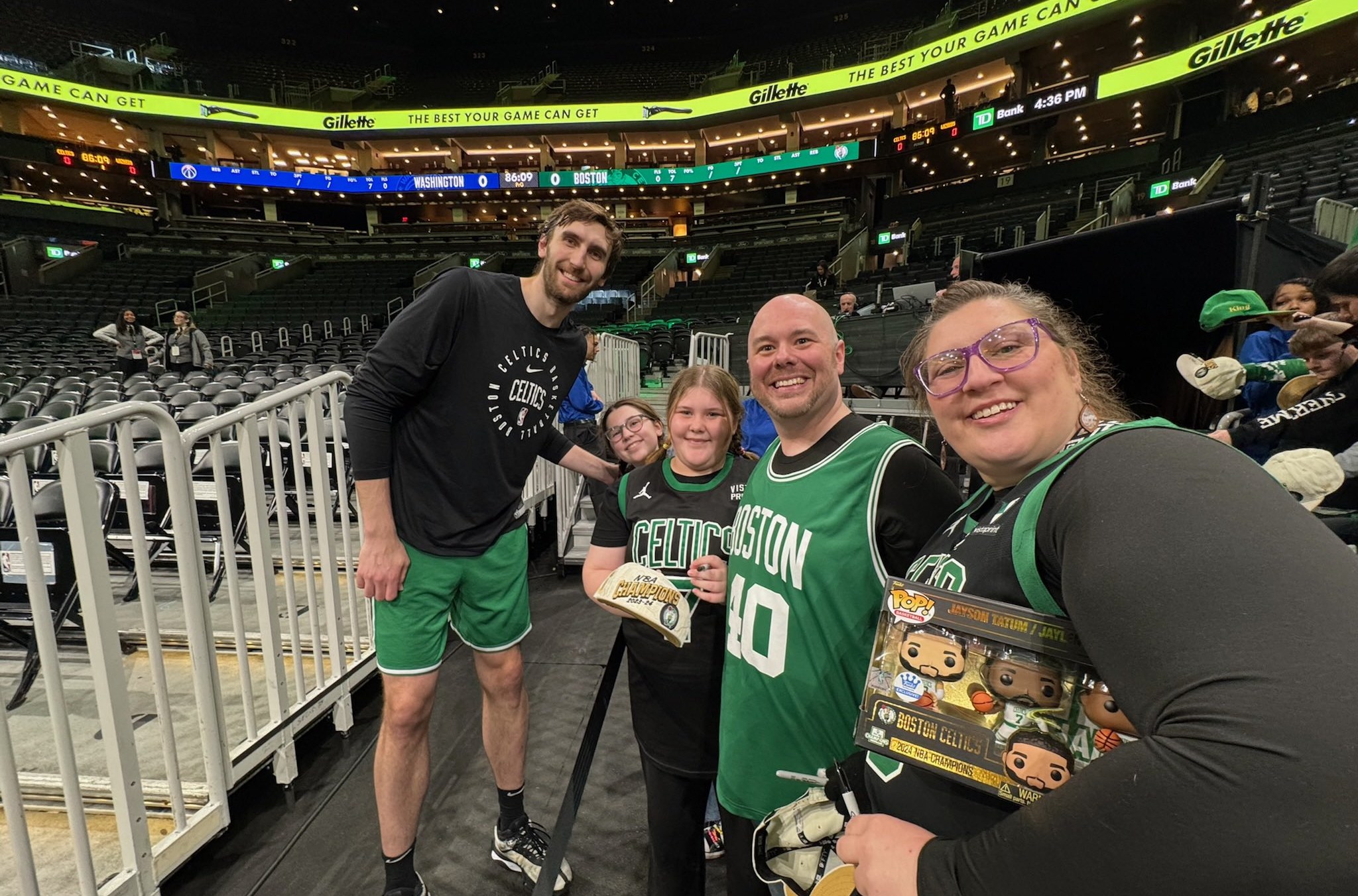 Craig Morency reconnects with Luke Kornet at TD Garden after receiving the news that he was cancer-free.