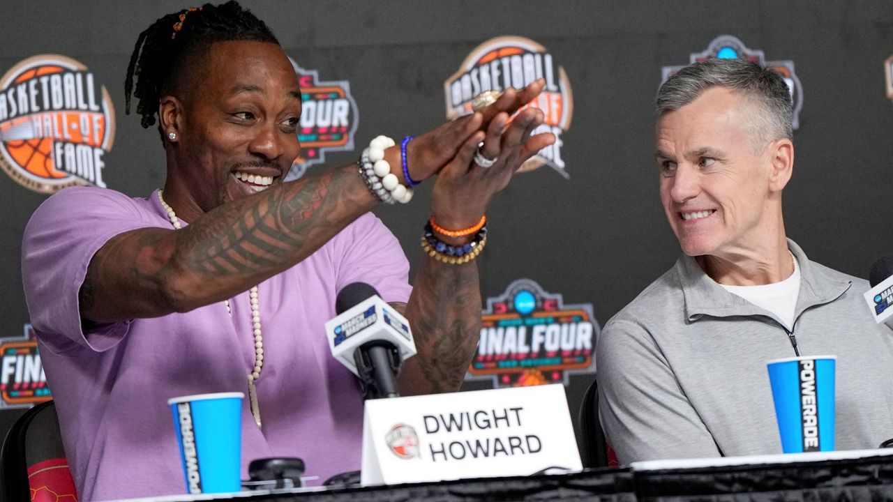 - Dwight Howard, left, shows his support for the Florida Gators as Billy Donovan, right, watches during a Naismith Hall Fame Class of 2025 inductee news conference at the Final Four of the NCAA college basketball tournament Saturday, April 5, 2025, in San Antonio. (AP Photo/David J. Phillip,File)