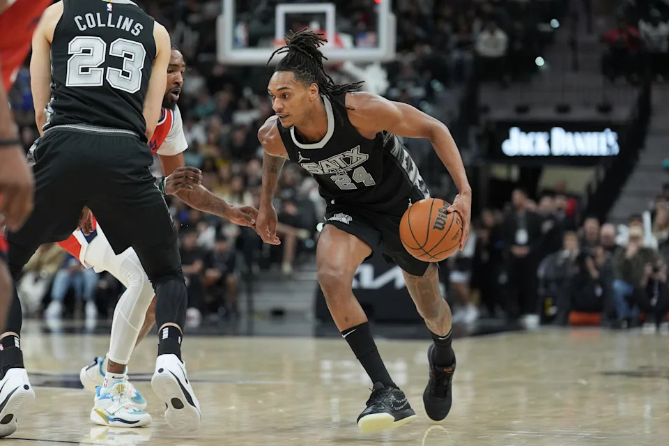Dec 31, 2024; San Antonio, Texas, USA; San Antonio Spurs guard Devin Vassell (24) dribbles in the second half against the LA Clippers at Frost Bank Center. Mandatory Credit: Daniel Dunn-Imagn Images
