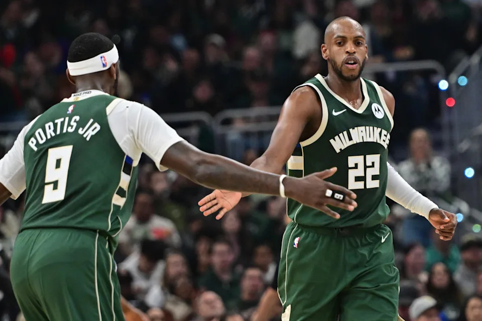 Milwaukee Bucks forward Khris Middleton (22) is greeted by forward Bobby Portis (9Benny Sieu-USA TODAY Sports