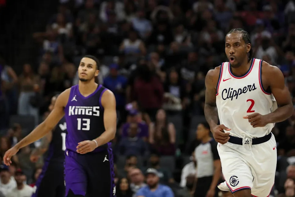 Clippers forward Kawhi Leonard reacts after making a three-pointer against the Kings on Friday night.
