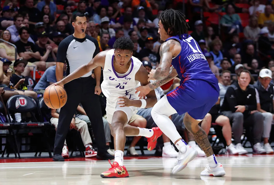 SALT LAKE CITY, UT - JULY 5 : Ace Bailey #19 of the Utah Jazz works the ball agaisnt Jalen Hood-Schifino #17 of the Philadelphia 76ers during the second half of their NBA Summer League game at the Jon M. Huntsman Center on July 5, 2025 in Salt Lake City, Utah. NOTE TO USER: User expressly acknowledges and agrees that, by downloading and or using this photograph, User is consenting to the terms and conditions of the Getty Images License Agreement. (Photo by Chris Gardner/Getty Images)