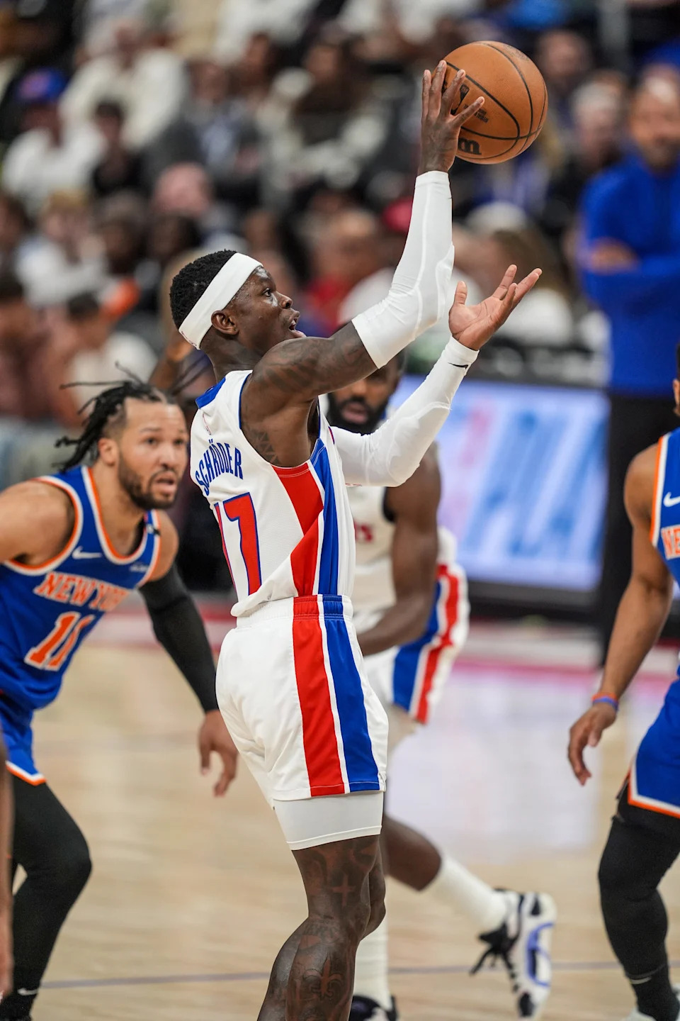 Detroit Pistons guard Dennis Schroder (17) throws the ball up for Detroit Pistons center Jalen Duren (0) during the second half of Game 6 for the first round of NBA playoffs at Little Caesars Arena in Detroit, May 1, 2025.