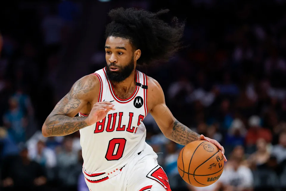 Apr 6, 2025; Charlotte, North Carolina, USA; Chicago Bulls guard Coby White (0) drives to the basket against the Charlotte Hornets during the second half at Spectrum Center. Mandatory Credit: Nell Redmond-Imagn Images