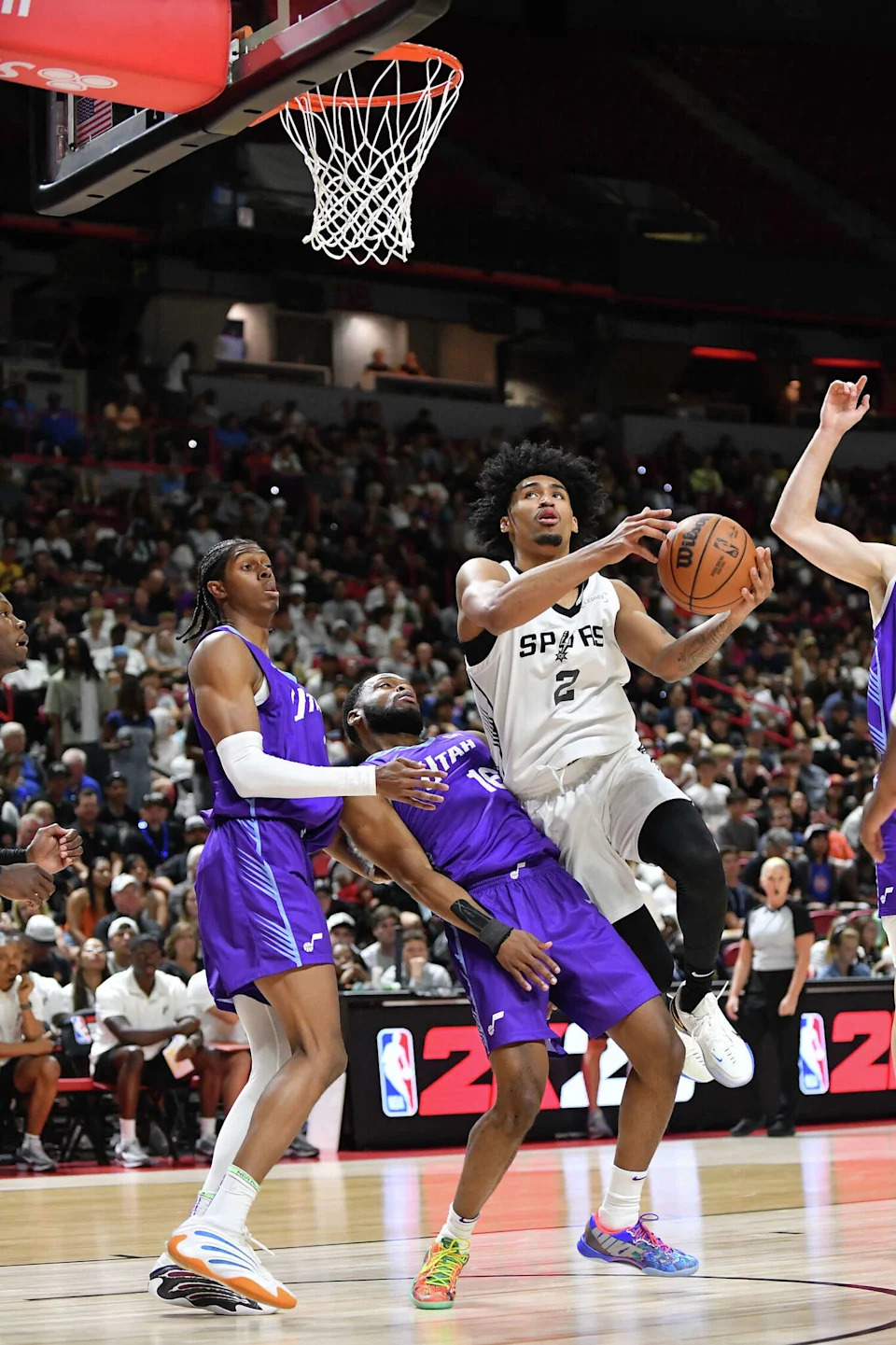 Dylan Harper #2 of San Antonio Spurs attacks the basket against Elijah Harkless #16 of Utah Jazz during 2025 NBA Summer League game between the Utah Jazz and San Antonio Spurs at the Thomas & Mack Center on July 14, 2025 in Las Vegas, Nevada. (Allen Berezovsky/Getty Images)