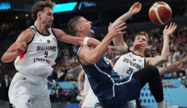 Germany's Franz Wagner, left, Slovenia's Alen Omic, centre, Germany's Justus Hollatz in action during the Eurobasket, European Basketball Championship quarter final match between Germany and Slovenia at the Riga Arena in Riga, Latvia, Wednesday, Sept. 10, 2025. (AP Photo/Sergei Grits)