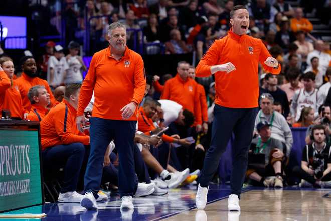 COLLEGE BASKETBALL: MAR 14 SEC Championship - Auburn vs Ole Miss NASHVILLE, TN - MARCH 14: Auburn Tigers head coach Bruce Pearl and his son and assistant coach Steven Pearl on the sidelines during a second round game of the SEC Tournament between the Auburn Tigers and Mississippi Rebels, March 14, 2025 at Bridgestone Arena in Nashville, Tennessee. (Photo by Matthew Maxey/Icon Sportswire via Getty Images via Getty Images)