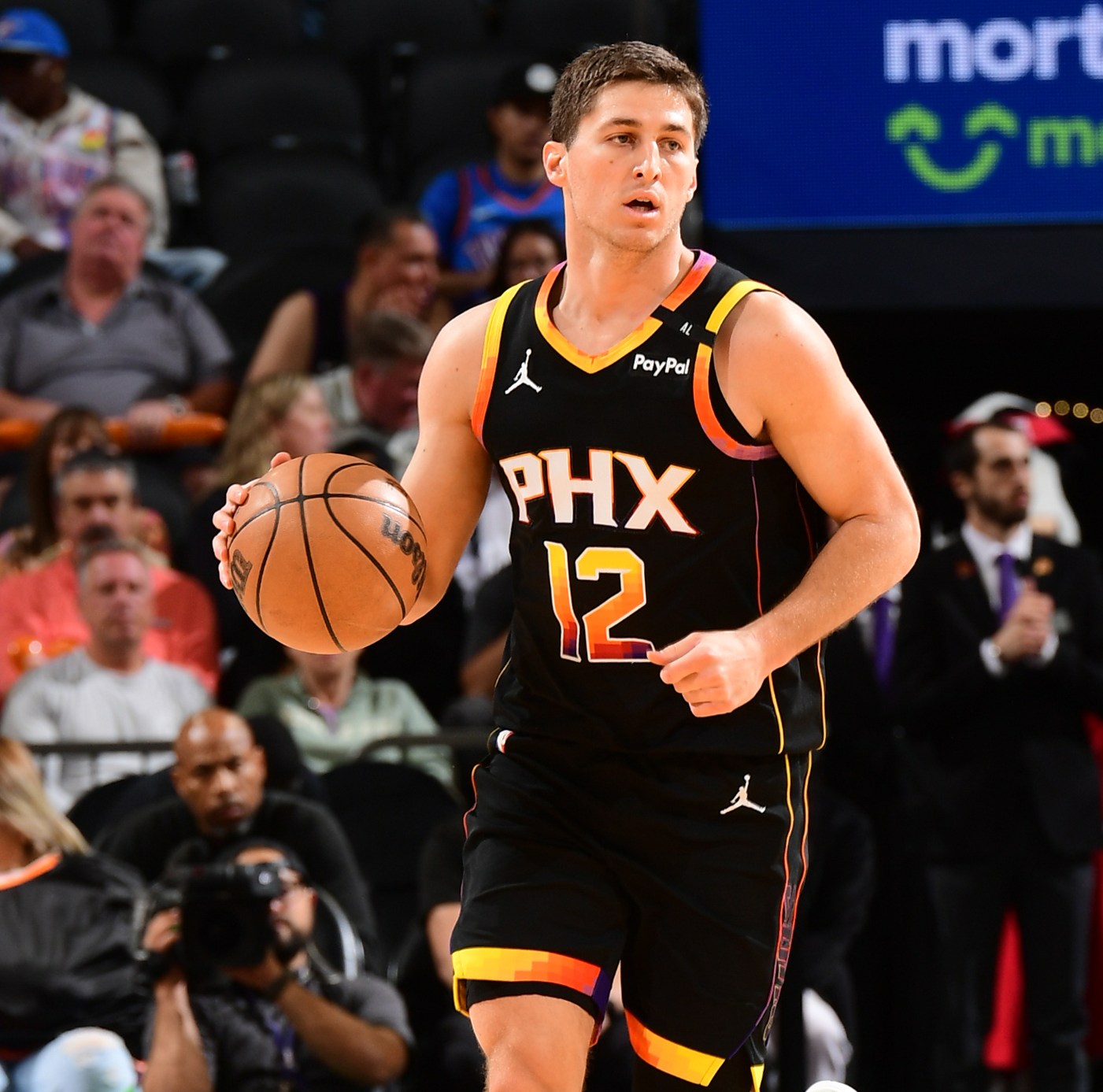 PHOENIX, AZ - APRIL 9: Collin Gillespie #12 of the Phoenix Suns dribbles the ball during the game against the Oklahoma City Thunder on April 9, 2025 at PHX Arena in Phoenix, Arizona. NOTE TO USER: User expressly acknowledges and agrees that, by downloading and or using this photograph, user is consenting to the terms and conditions of the Getty Images License Agreement. Mandatory Copyright Notice: Copyright 2025 NBAE (Photo by Kate Frese/NBAE via Getty Images)