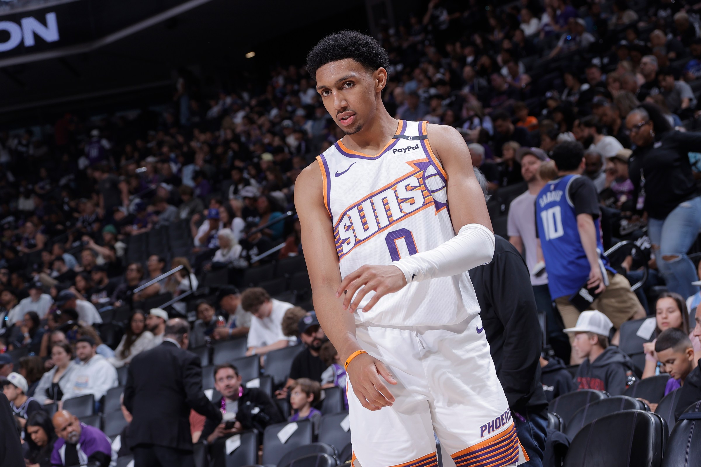 SACRAMENTO, CA - APRIL 13: Ryan Dunn #0 of the Phoenix Suns looks on during halftime in a game against the Sacramento Kings on April 13, 2025 at Golden 1 Center in Sacramento, California. NOTE TO USER: User expressly acknowledges and agrees that, by downloading and or using this photograph, User is consenting to the terms and conditions of the Getty Images Agreement. Mandatory Copyright Notice: Copyright 2025 NBAE (Photo by Rocky Widner/NBAE via Getty Images)