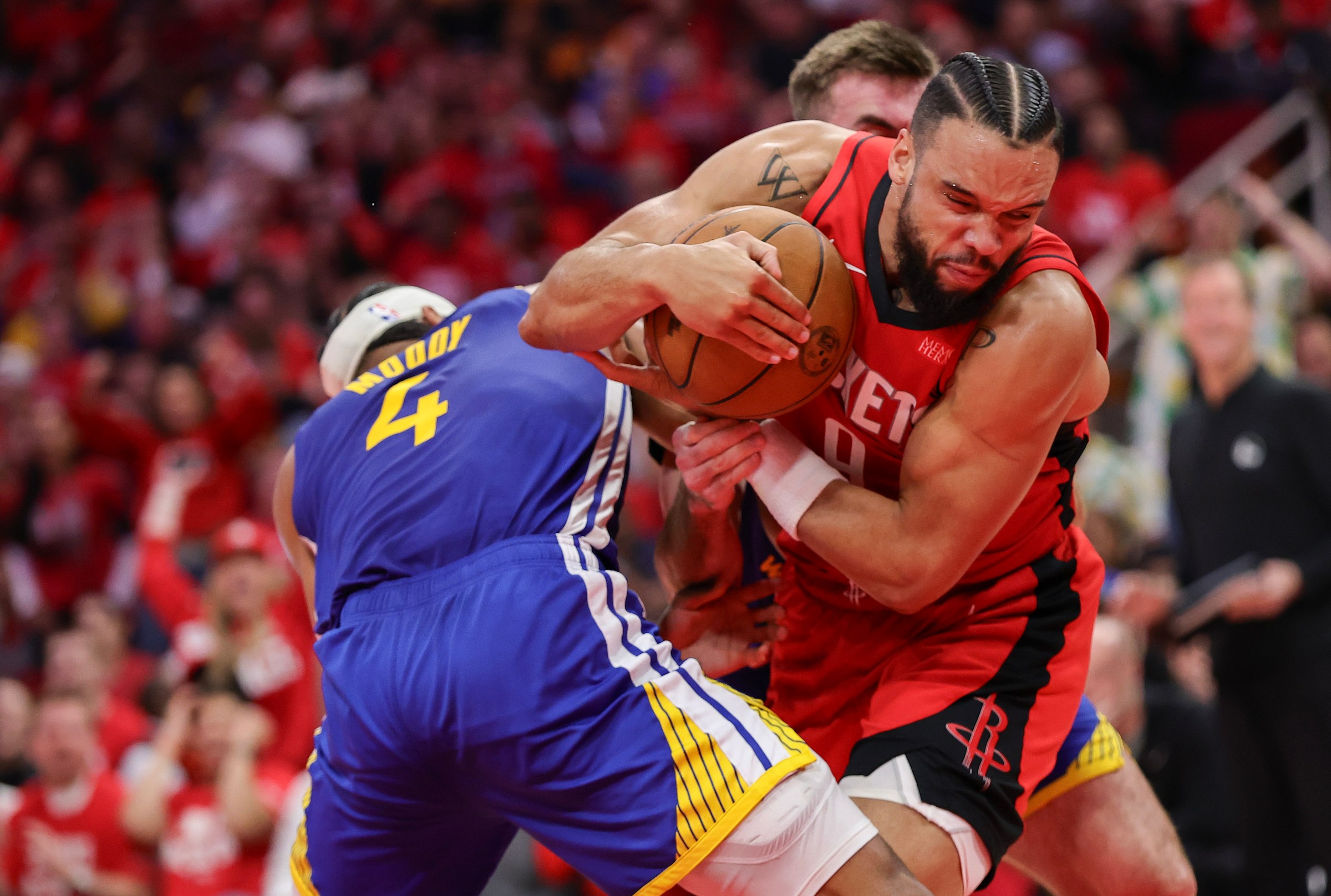 HOUSTON, TEXAS - APRIL 30: Dillon Brooks #9 of the Houston Rockets battles between Moses Moody #4 and Pat Spencer #61 of the Golden State Warriors during the fourth quarter in Game Five of the Western Conference First Round NBA Playoffs at Toyota Center on April 30, 2025 in Houston, Texas. NOTE TO USER: User expressly acknowledges and agrees that, by downloading and or using this photograph, User is consenting to the terms and conditions of the Getty Images License Agreement. (Photo by Alex Slitz/Getty Images)