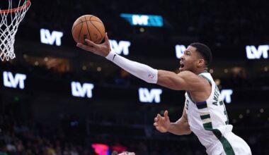 Milwaukee Bucks forward Giannis Antetokounmpo, right, goes to the basket against the Utah Jazz during the first quarter of an NBA basketball game, Monday, Jan. 27, 2025, in Salt Lake City. (AP Photo/Rob Gray)