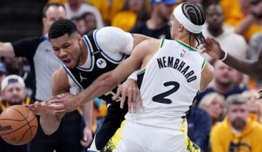 Milwaukee Bucks' Giannis Antetokounmpo, left, dribbles as Indiana Pacers' Andrew Nembhard (2) defends during the first half of a first-round NBA basketball playoff game, Saturday, April 19, 2025, in Indianapolis.