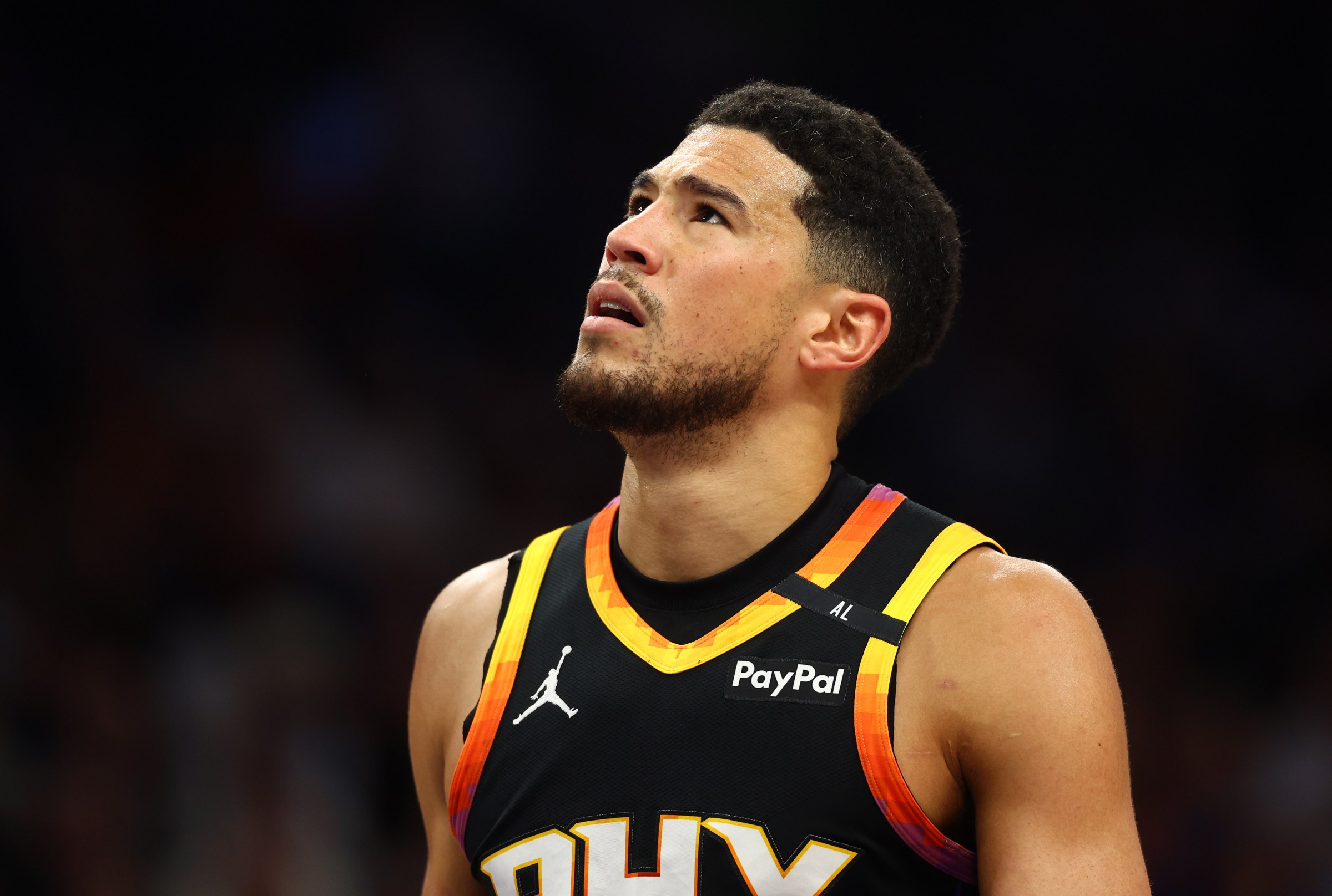 Apr 9, 2025; Phoenix, Arizona, USA; Phoenix Suns guard Devin Booker (1) reacts after a play against the Oklahoma City Thunder during the first half at Footprint Center. Mandatory Credit: Mark J. Rebilas-Imagn Images