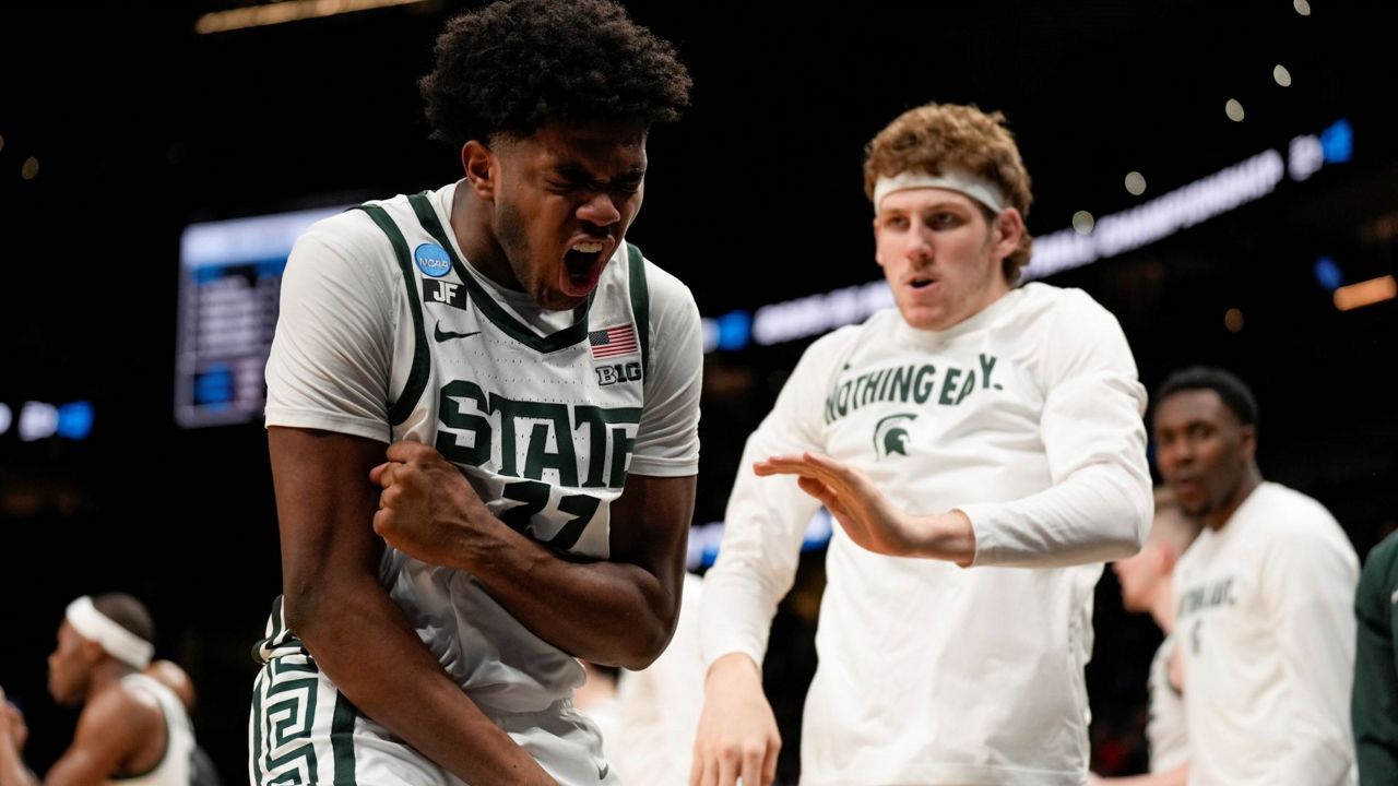 Michigan State guard Jase Richardson (11) reacts to play against Mississippi during the first half in the Sweet 16 of the NCAA college basketball tournament, Friday, March 28, 2025, in Atlanta. (AP Photo/George Walker IV)