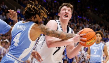 Duke's Kon Knueppel (7) drives as North Carolina's RJ Davis (4) defends during an NCAA college basketball game in Durham, N.C., Saturday, Feb. 1, 2025. (AP Photo/Ben McKeown)