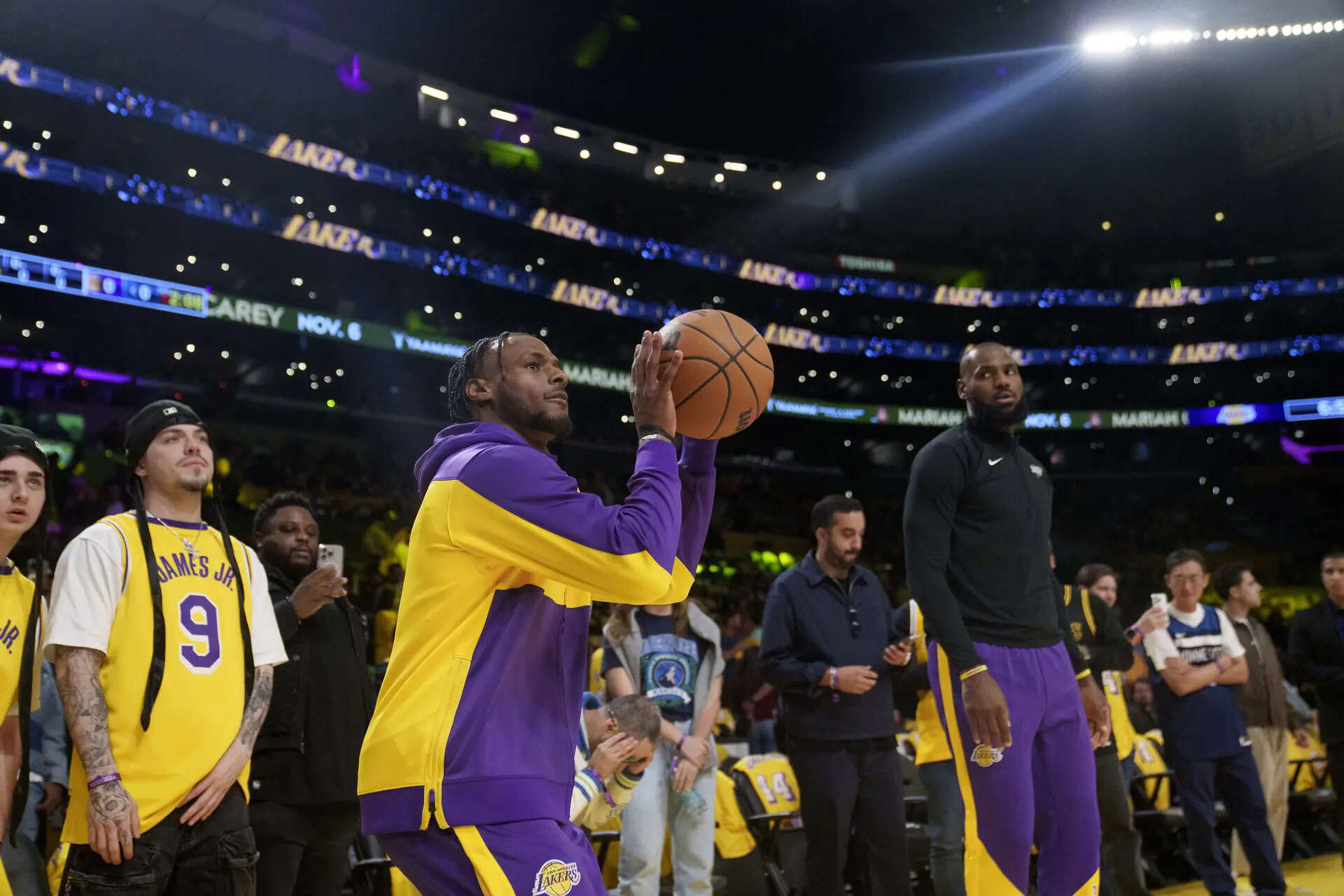 Los Angeles Lakers guard Bronny James, left, and forward LeBron James (Image via AP Photo/Eric Thayer, File) LeBron James and his son could be traded to the Denver Nuggets