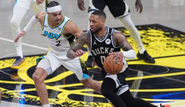 Milwaukee Bucks guard Damian Lillard (0) drives on Indiana Pacers guard Andrew Nembhard (2) during the first half of a first-round NBA basketball playoff game in Indianapolis, Tuesday, April 22, 2025.