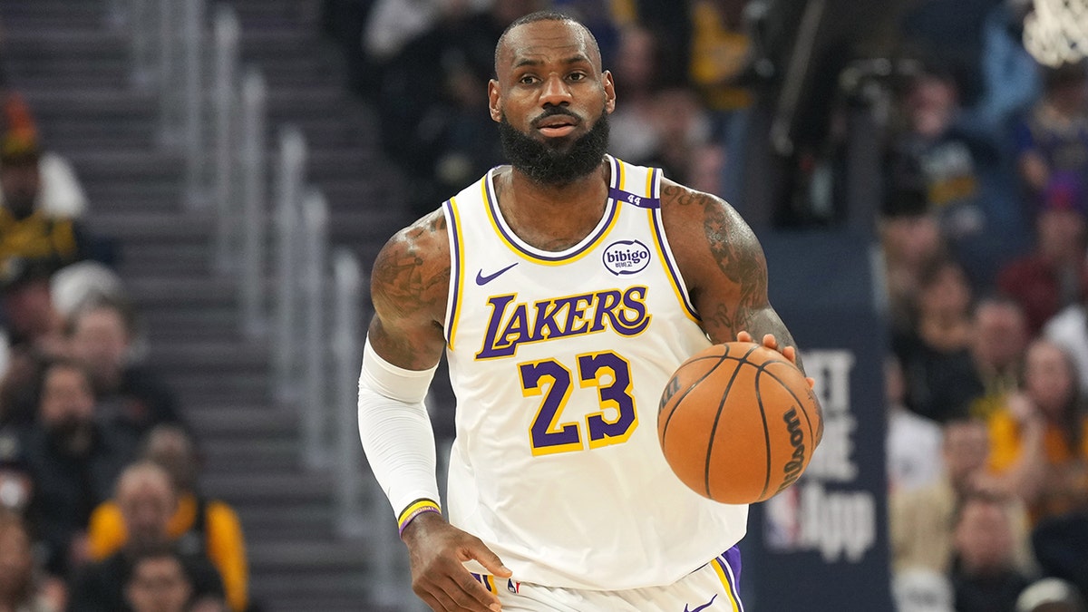 LeBron James dribbles