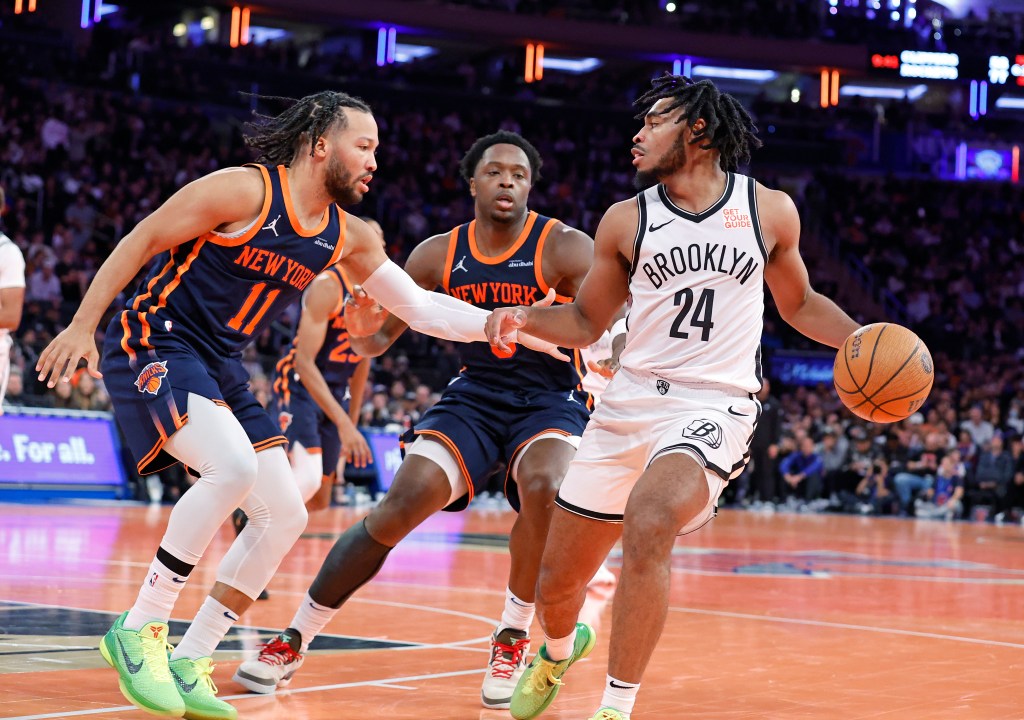New York Knicks guard Jalen Brunson defends against Brooklyn Nets guard Cam Thomas during the fourth quarter.