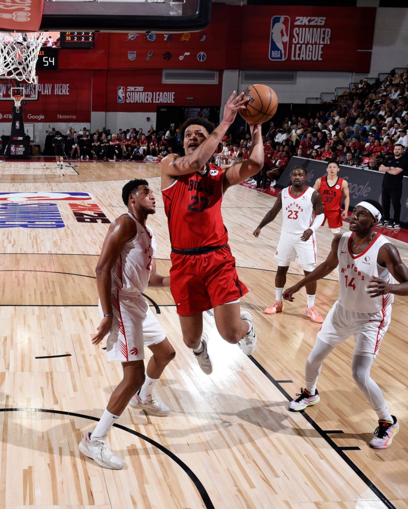 Chicago Bulls player shooting a basketball during an NBA Summer League game against the Toronto Raptors.