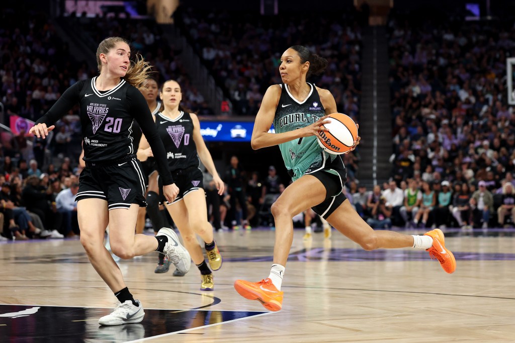 New York Liberty's Rebekah Gardner dribbling the ball, guarded by Golden State Valkyries' Kate Martin.