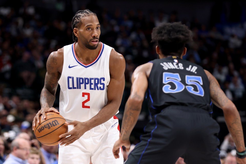 Kawhi Leonard #2 of the LA Clippers dribbling the ball, defended by Derrick Jones Jr. #55 of the Dallas Mavericks.
