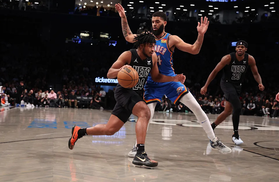 NEW YORK, NEW YORK - JANUARY 05: Cam Thomas #24 of the Brooklyn Nets drives against Kenrich Williams #34 of the Oklahoma City Thunder during their game at Barclays Center on January 05, 2024 in New York City. User expressly acknowledges and agrees that, by downloading and or using this photograph, User is consenting to the terms and conditions of the Getty Images License Agreement. (Photo by Al Bello/Getty Images)