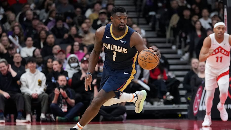 Pelicans forward Zion Williamson dribbles the ball up court against the Raptors.