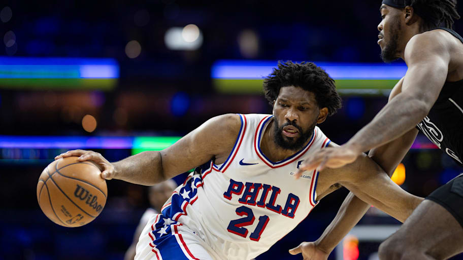76ers center Joel Embiid controls the ball against Nets center Day'Ron Sharpe.