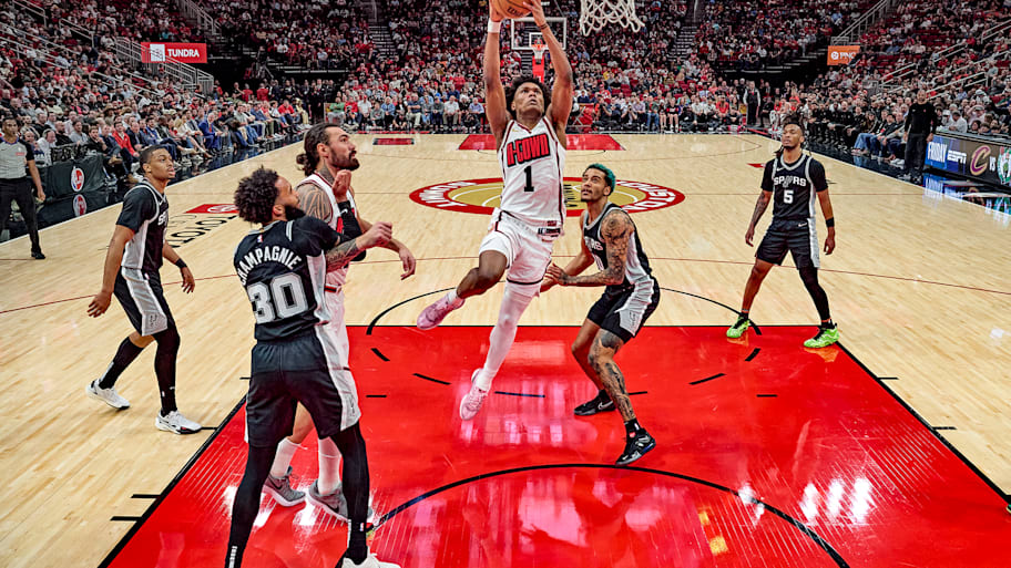 Rockets guard Amen Thompson goes up to the basket.