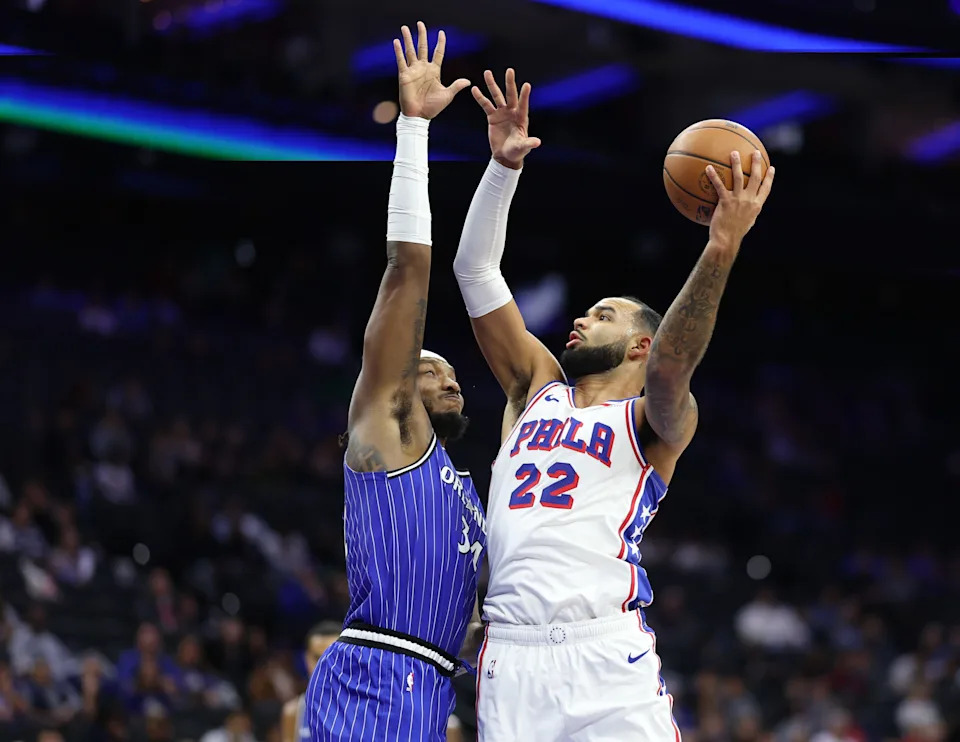 Oct 10, 2025; Philadelphia, Pennsylvania, USA; Philadelphia 76ers forward Johni Broome (22) drives for a shot past Orlando Magic center/forward Wendell Carter Jr. (34) during the second quarter at Xfinity Mobile Arena. Mandatory Credit: Bill Streicher-Imagn Images