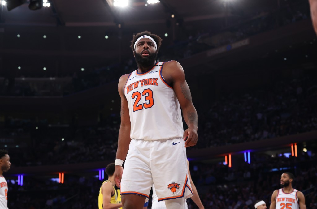 New York Knicks center Mitchell Robinson #23 reacts on the floor during the third quarter.