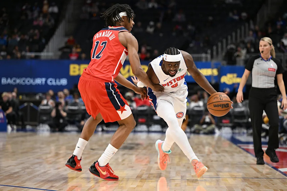 Detroit Pistons guard Caris Levert (8) tries to drive past Washington Wizards guard Tre Johnson (12)Lon Horwedel-Imagn Images