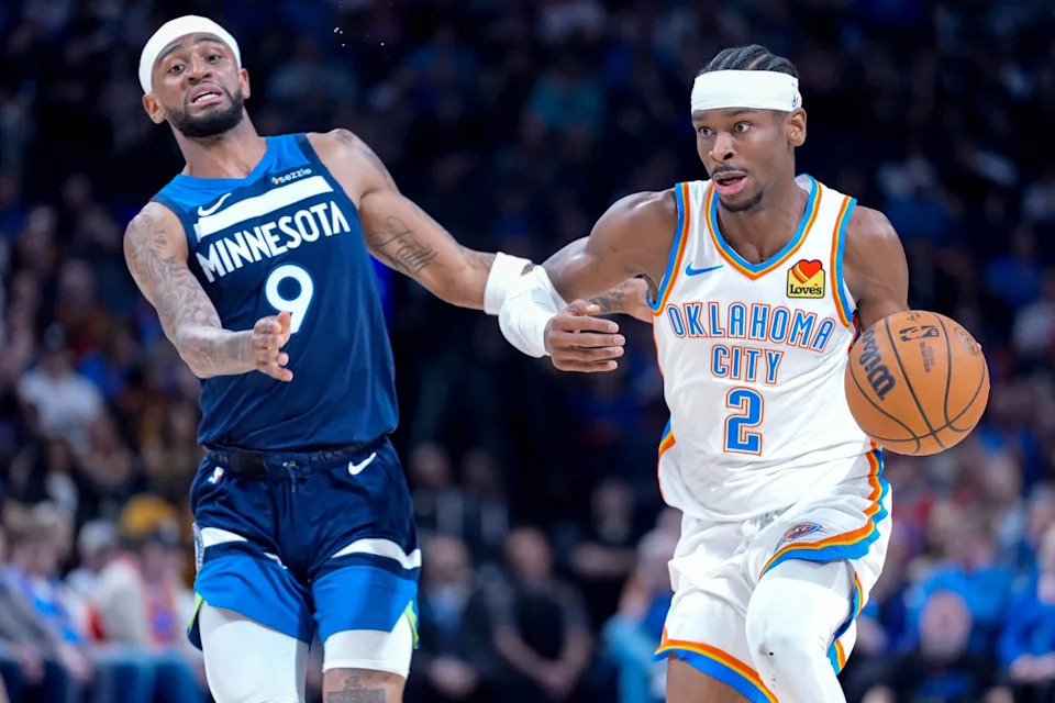 Thunder guard Shai Gilgeous-Alexander (2) drives past Timberwolves guard Nickeil Alexander-Walker (9) on Feb. 24 at Paycom Center.