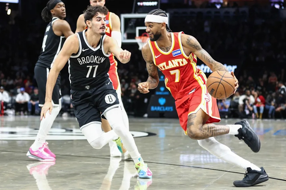 Atlanta Hawks guard Nickeil Alexander-Walker (7) drives past Brooklyn Nets guard Ben Saraf (77) in the third quarter at Barclays Center. Wendell Cruz-Imagn Images