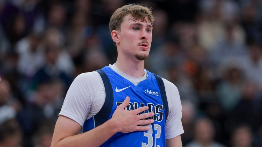 Dallas Mavericks forward Cooper Flagg (32) looks on during the first half of a preseason NBA game a...