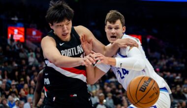 Portland Trail Blazers center Yang Hansen (16) and Utah Jazz center Walker Kessler (24)...