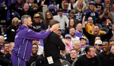 Utah Jazz forward Kevin Love (42) covers the ears of Utah Jazz head coach Will Hardy...