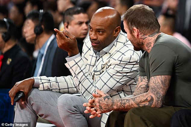 The father-of-four looked transfixed by the scenes on the court, in between chatting to former NBA player Vince Carter