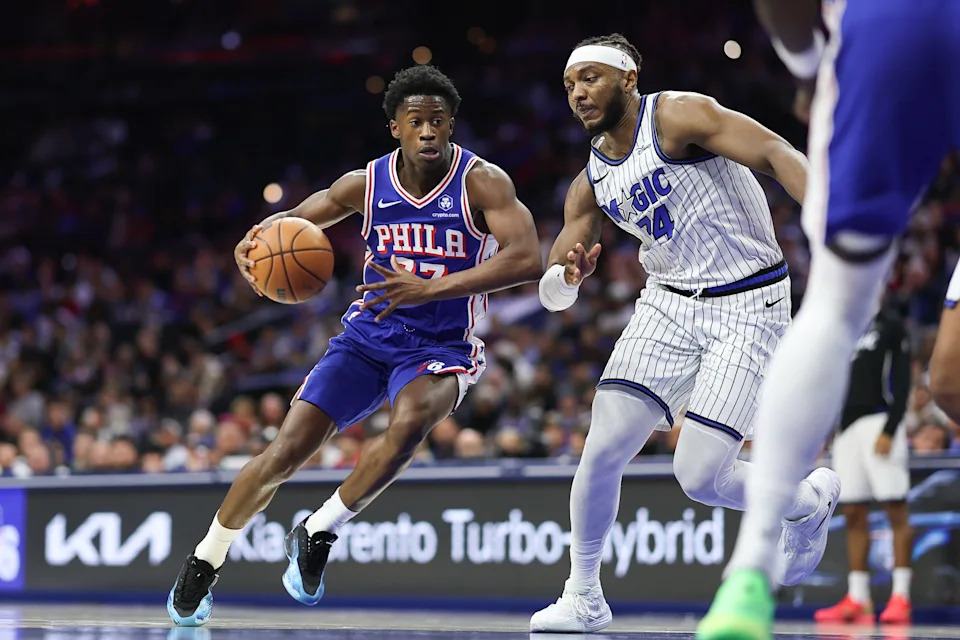 Oct 27, 2025; Philadelphia, Pennsylvania, USA; Philadelphia 76ers guard VJ Edgecombe (77) drives against Orlando Magic center Wendell Carter Jr. (34) during the third quarter at Xfinity Mobile Arena. Mandatory Credit: Bill Streicher-Imagn Images