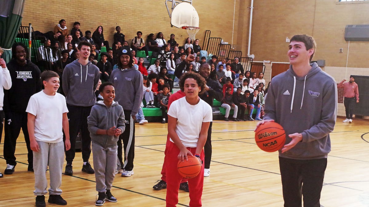 Stonehill D1 basketball players visit South Middle School