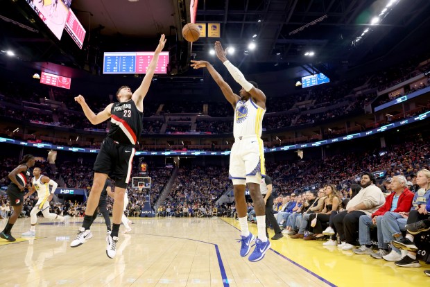 Golden State Warriors' Jonathan Kuminga (1) lays up a shot against Portland Trail Blazers' Donovan Clingan (23) in the second quarter of an NBA preseason game at Chase Center in San Francisco, Calif., on Wednesday, Oct. 8, 2025. (Ray Chavez/Bay Area News Group)