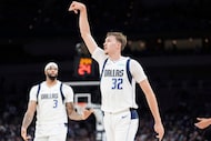Dallas Mavericks forward Cooper Flagg (32) celebrates a 3-pointer with forward/center...