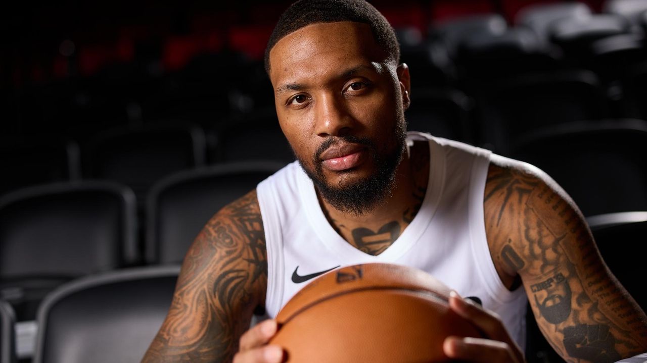 Not currently playing and not a coach, Damian Lillard has a unique role with the Blazers