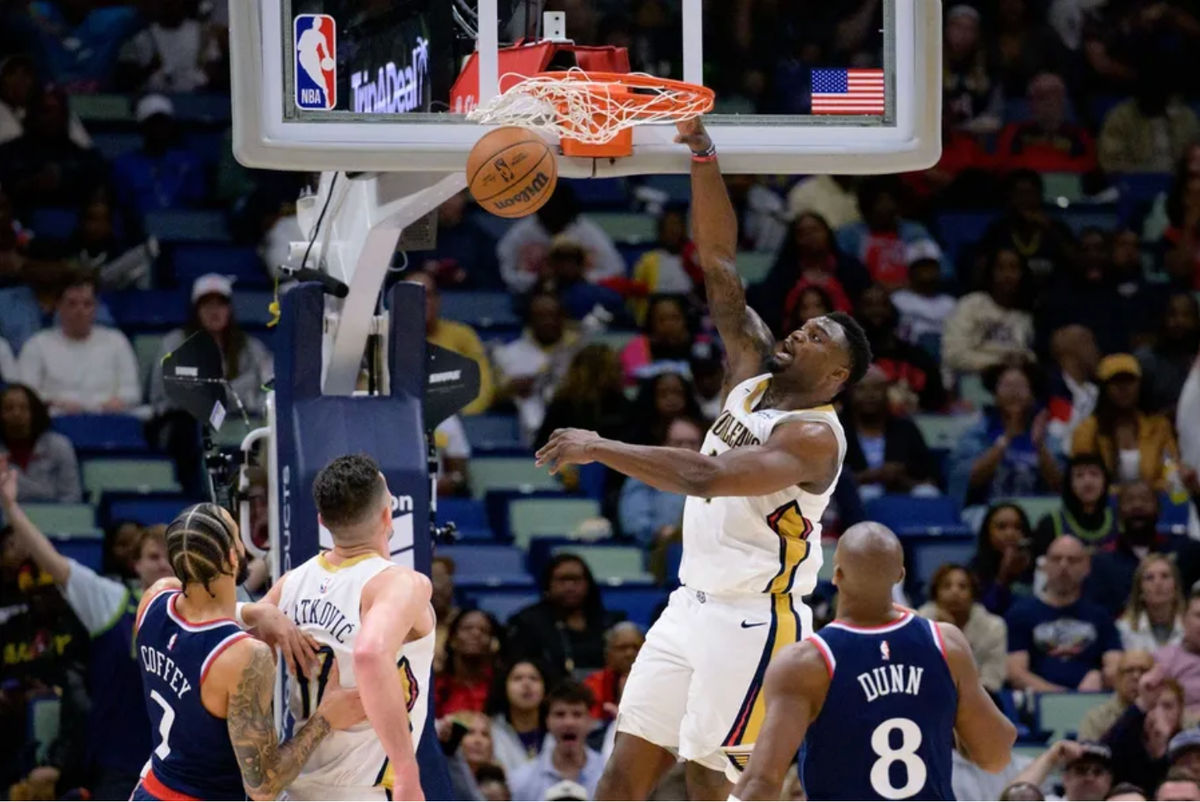 Mar 11, 2025; New Orleans, Louisiana, USA; New Orleans Pelicans forward Zion Williamson (1) dunks against Los Angeles Clippers guard Kris Dunn (8) during the second half at Smoothie King Center. Mandatory Credit: Matthew Hinton-Imagn Images