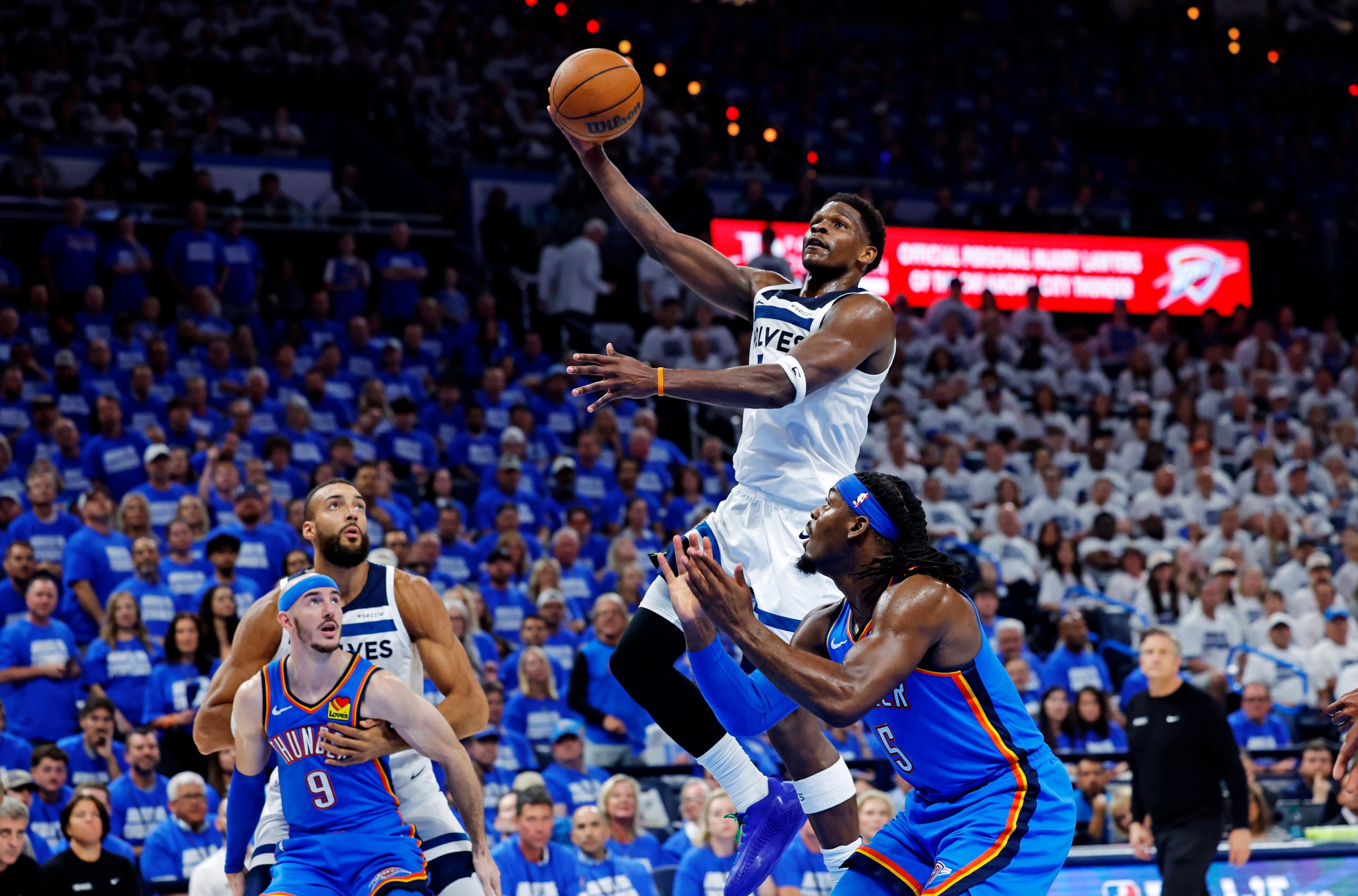 Minnesota Timberwolves guard Anthony Edwards (5) shoots the ball againts Oklahoma City Thunder forward Jaylin Williams (6) during the second quarter in game five of the western conference finals for the 2025 NBA Playoffs at Paycom Center.