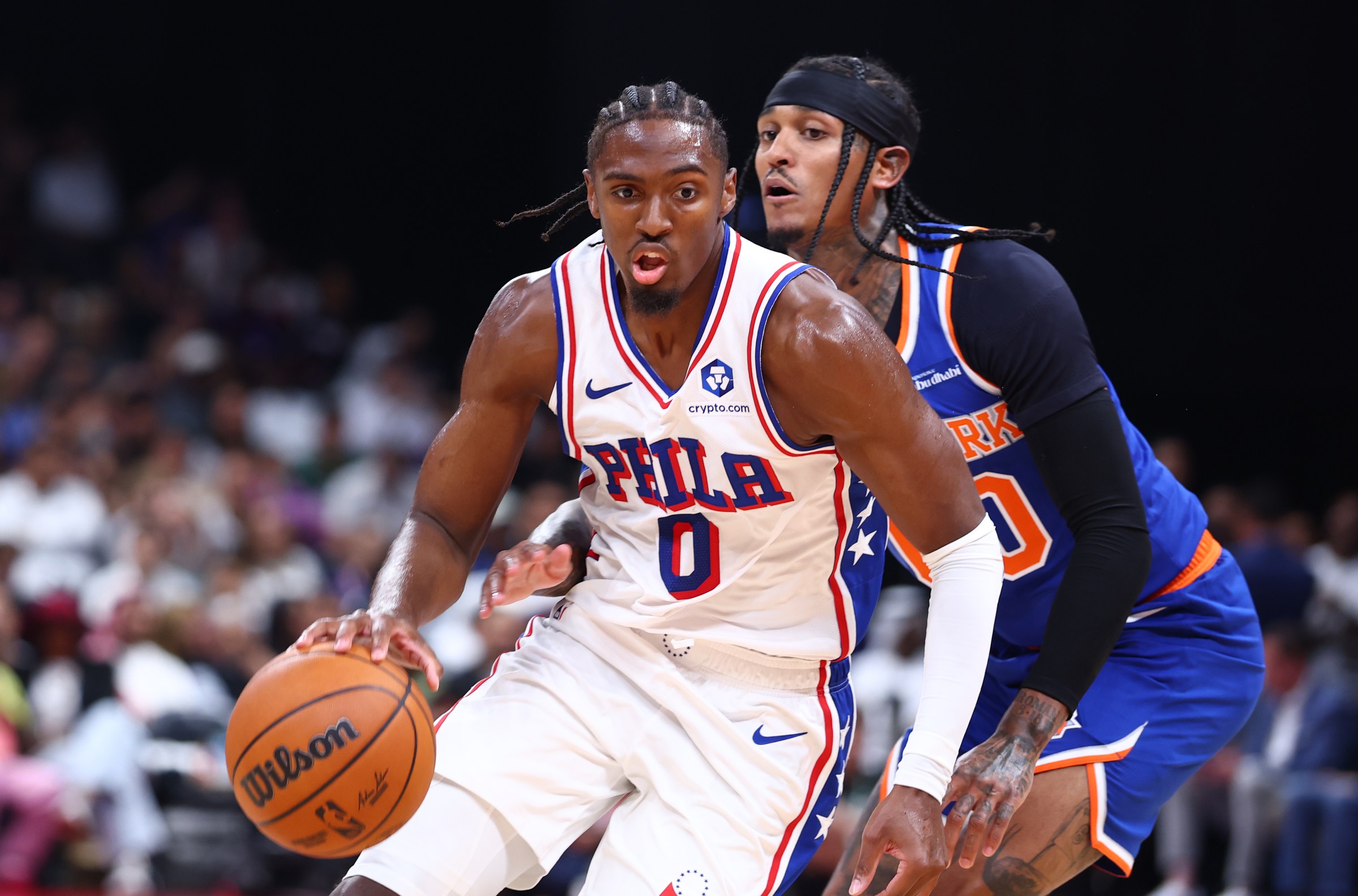 ABU DHABI, UNITED ARAB EMIRATES - OCTOBER 02: Tyrese Maxey #0 of Philadelphia 76ers dribbles the ball past Jordan Clarkson #00 of New York Knicks during a preseason game between Philadelphia 76ers and New York Knicks on October 02, 2025 in Abu Dhabi, United Arab Emirates. NOTE TO USER: User expressly acknowledges and agrees that, by downloading and/or using this Photograph, user is consenting to the terms and conditions of the Getty Images License Agreement. (Photo by Francois Nel/Getty Images)